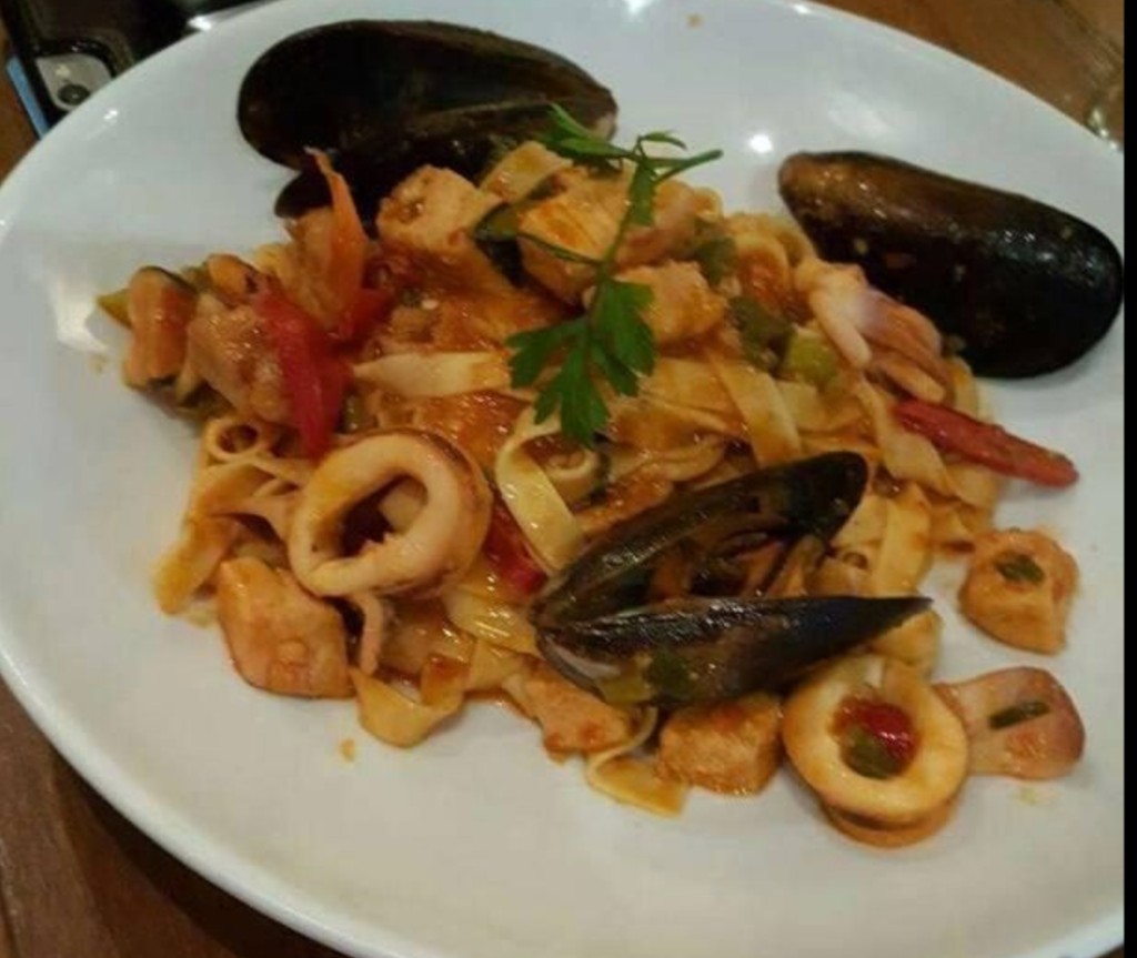 Seafood spaghetti with mussels, calamari and prawns in a light tomato wine sauce